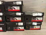 several boxes of tennis shoes are stacked on top of each other