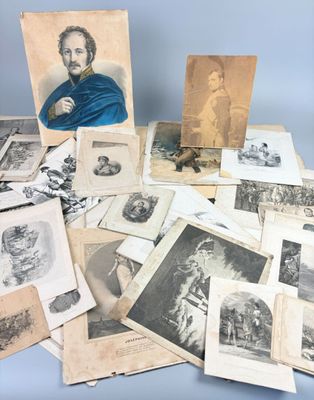 an old photo of a man sitting on top of a pile of old photos