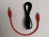 a red cable that is connected to a black and white charger