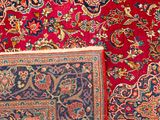 a close up of a rug with a red and blue background