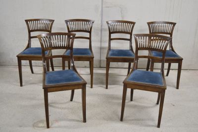 six chairs that are lined up in a row