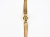 an image of a gold watch on a white surface