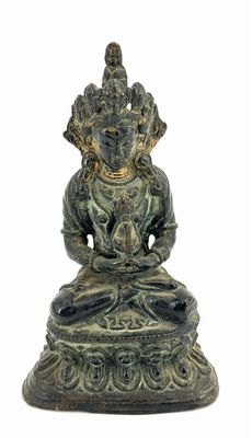 an image of a statue of a person sitting in a lotus position