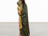 an image of a statue of a woman holding a child