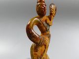 an image of a statue of a woman holding a bird