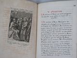 an open book with a picture of a group of people on it