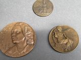 three different types of coins are shown on a gray surface