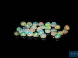 white fire oplite beads on a black background