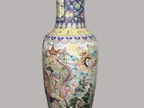 a vase that has a picture of a dragon on it