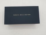 a black business card with a gold logo on it