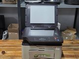 a printer that is sitting on top of a wooden table