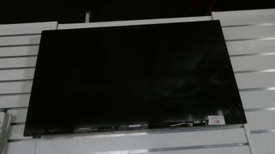 a flat screen tv mounted on a wall in a room