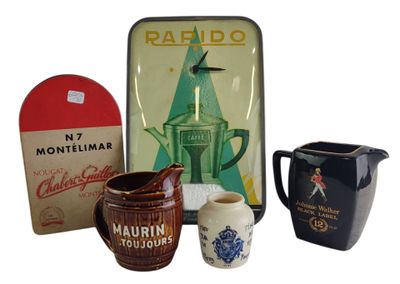 three different types of coffee mugs and a box