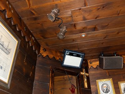 a television mounted on the ceiling of a cabin
