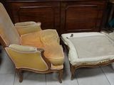 two chairs and a foot stool in a room