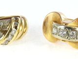 two pairs of diamond earrings on a white surface