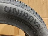 a close up of a tire on a box with a cardboard box in the background