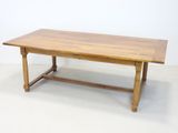 an image of a table with a wooden top on a white floor