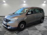 the silver van is parked on a checkered floor in a room