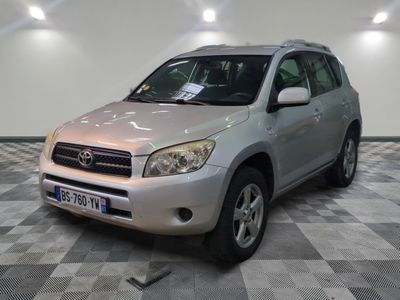 a picture of a silver toyota rav parked in a garage