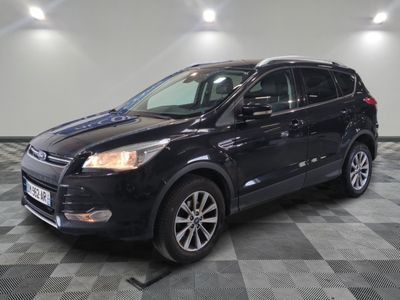 a black ford kuga is parked in a large room