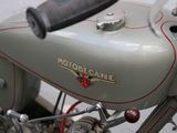 a close up of a motorcycle with a red stripe on it
