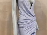 the mannequin is wearing a purple dress with a v - neck