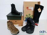 two pairs of boots and a box on a table