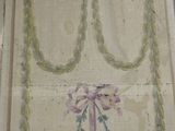 painting on the wall of an old building with a decorative design on it