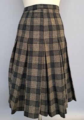 Yves SAINT-LAURENT Jupe plissée en lainage à carreaux, fond …