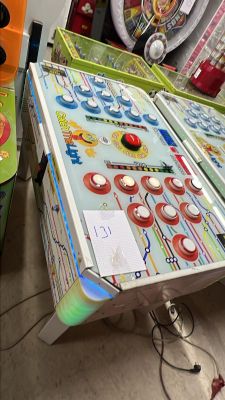 a table with a pinball game on it in a room