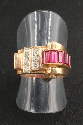 an image of a gold ring with red and white stones