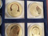 the gold coins are in a display case with blue velvet lining