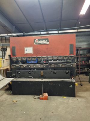 an image of a large machine in a warehouse with lots of tools
