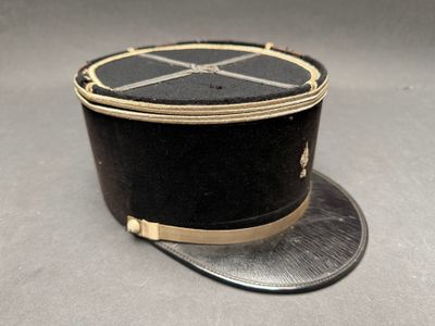 a black hat with a gold band on top of it