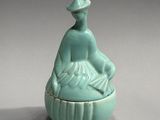 chinese celade glazed porcelain figure of a seated woman on a lotus