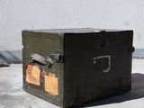 a small metal box sitting on the concrete floor
