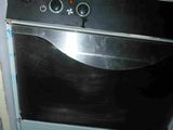 an image of a black stove in a dirty kitchen