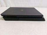 a black laptop sitting on top of a white table