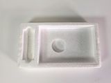 a close up of a small white object on a table