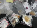 several bags of food sitting on top of a table covered in sticky notes