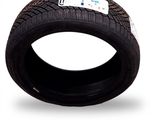 an image of a tire on a white background with a sticker on it