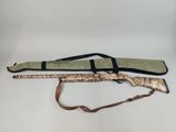 a close up of a rifle with a rifle case on a white background
