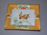 a yellow plate with a picture of a flamingo on it
