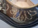 a reflection of a person in a mirror on a table