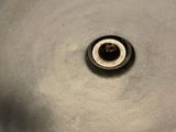 a metal sink with a metal faucet in it