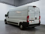 a white van that is parked in a room