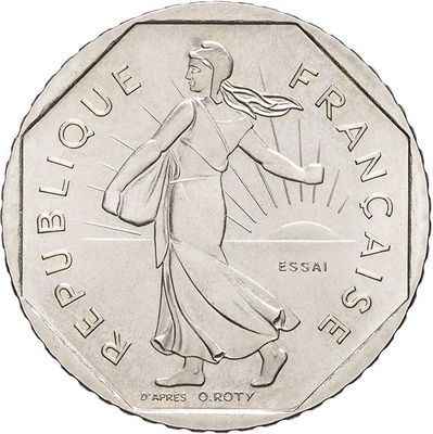 the coin has a design of a woman carrying a bag