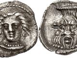 a silver coin with an image of a man ' s face on it
