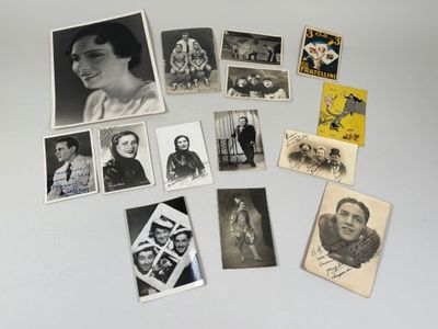 a lot of old black and white photos on the table